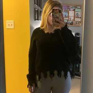 fringed black sweater